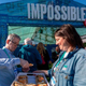 People smiling at Impossible Foods event